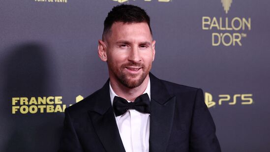 Lionel Messi poses before the awards.