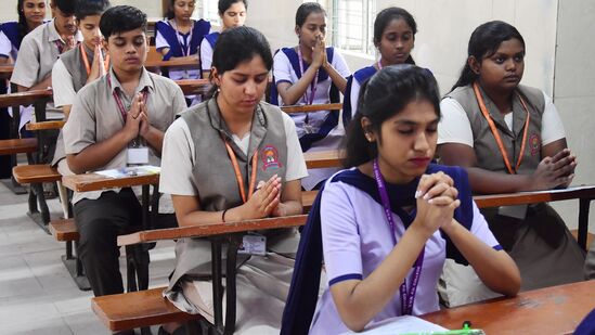 Bengaluru, Mar 01 (ANI): Students pray before taking their Karnataka 2nd PUC Board exams 2024, in Bengaluru on Friday. (ANI Photo)