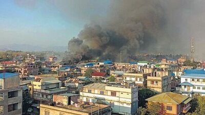 Smoke billows from a fire that broke out amid clashes between armed groups and security forces in Manipur on Sunday. (PTI)