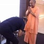 Rajinikanth touches Yogi Adityanath feet