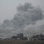 Smoke rises following an Israeli airstrike in the Gaza Strip, as seen from southern Israel, Sunday, Nov. 12, 2023. (AP Photo/Leo Correa)