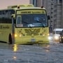 A school bus and other vehicle partially submerged as heavy rains batter parts of the UAE. (Al Arabiya News/X)