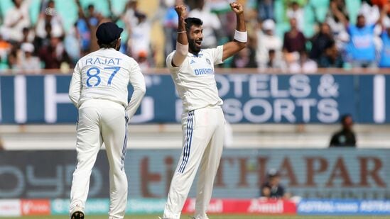 India's Jasprit Bumrah and teammates celebrate