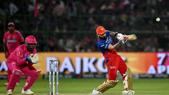 Royal Challengers Bengaluru's Virat Kohli (R) plays a shot.