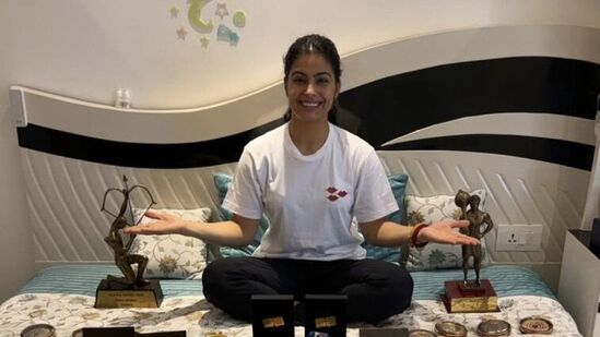 Olympic medalist Manu Bhaker poses with all her medals.