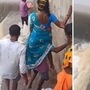 ओसंडून वाहणाऱ्या नाल्याच्या प्रवाहातून जाताना नागरिक