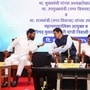 Maharashtra Chief Minister Devendra Fadnavis interacts with State Deputy Chief Minister Eknath Shinde