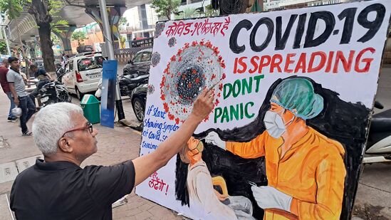 Mumbai, May 21 (ANI): A teacher of Gurukul School of Art makes an awareness painting of COVID 19, in Mumbai on Wednesday. (ANI Photo)