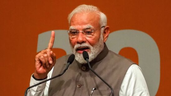 TOPSHOT - India's Prime Minister Narendra Modi addresses the gathering during an event marking 20 years of the Gujarat Urban Growth Story at Gandhinagar, in India's state of Gujarat, on May 27, 2025. (Photo by Sam PANTHAKY / AFP)
