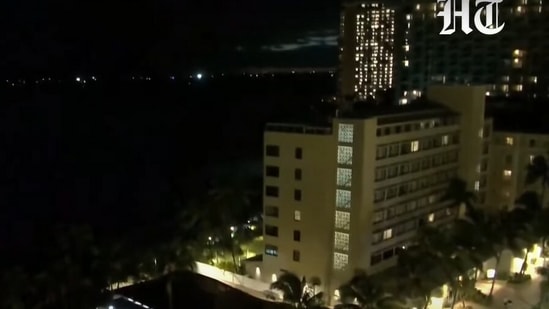 Screengrab from live stream shows calm Hawaii beach ahead of expected tsunami waves.