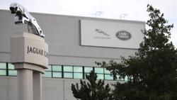 Signs are seen outside the Jaguar Land Rover plant at Halewood in Liverpool, northern England Signs are seen outside the Jaguar Land Rover plant at Halewood in Liverpool, northern England