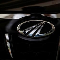 The logo of Mahindra and Mahindra is seen on a car at a showroom in Mumbai. The logo of Mahindra and Mahindra is seen on a car at a showroom in Mumbai.