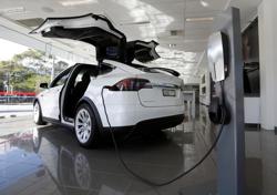 File photo of a Tesla wall connector demonstrating the charging at home of a Model X vehicle at a Tesla electric car dealership in Sydney. File photo of a Tesla wall connector demonstrating the charging at home of a Model X vehicle at a Tesla electric car dealership in Sydney.