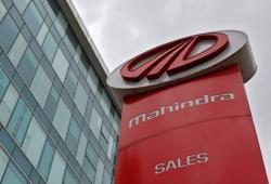 The logo of Mahindra and Mahindra is seen at a showroom in Mumbai. The logo of Mahindra and Mahindra is seen at a showroom in Mumbai.