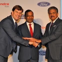Jim Farley, President of Ford New Businesses, Technology & Strategy, Pawan Goenka, Managing Director of Mahindra & Mahindra Limited, and Anand Mahindra, Chairman of Mahindra Group, join their hands after attending a news conference in Mumbai. Jim Farley, President of Ford New Businesses, Technology & Strategy, Pawan Goenka, Managing Director of Mahindra & Mahindra Limited, and Anand Mahindra, Chairman of Mahindra Group, join their hands after attending a news conference in Mumbai.
