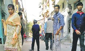 Residents passing by a manhole at Basant Nagar in Ludhiana on Monday.(HT Photo) Residents passing by a manhole at Basant Nagar in Ludhiana on Monday.(HT Photo)