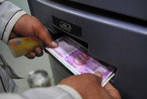 A man takes out Rs 2,000 banknotes from an ATM in November 2016. The government’s decision to replace 1,000 and 500 rupee banknotes with new 2,000 rupee notes has upset the country’s cash flow.(Shankar Mourya/HT File Photo) A man takes out Rs 2,000 banknotes from an ATM in November 2016. The government’s decision to replace 1,000 and 500 rupee banknotes with new 2,000 rupee notes has upset the country’s cash flow.(Shankar Mourya/HT File Photo)