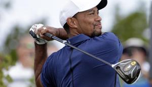 Tiger Woods watches his tee shot on the first hole during the second round at the Hero World Challenge golf tournament.(AP) Tiger Woods watches his tee shot on the first hole during the second round at the Hero World Challenge golf tournament.(AP)