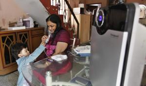 Asthma patient Santosh Garg has installed an air purifier at her house in Karol Bagh. WHO says 4.3 million people die of indoor pollution in the world every year.(Raj K Raj/HT Photo) Asthma patient Santosh Garg has installed an air purifier at her house in Karol Bagh. WHO says 4.3 million people die of indoor pollution in the world every year.(Raj K Raj/HT Photo)