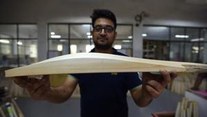 A bat manufacturer displaying an exceptionally thick wood that goes into making fat, custom-made bats. The Marylebone Cricket Club has recommended restrictions on the size of bats to ensure balance between bat and ball.(HT File) A bat manufacturer displaying an exceptionally thick wood that goes into making fat, custom-made bats. The Marylebone Cricket Club has recommended restrictions on the size of bats to ensure balance between bat and ball.(HT File)
