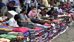 Vendors selling winter garments near CST wait for customers.(Arijit Sen/HT) Vendors selling winter garments near CST wait for customers.(Arijit Sen/HT)