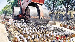 Liquor bottles are crushed under a road roller after the prohibition was announced in Bihar in April.(HT Photo) Liquor bottles are crushed under a road roller after the prohibition was announced in Bihar in April.(HT Photo)