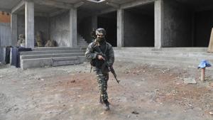 Security personnel at the site of the attack in Pampore on the outskirts of Srinagar on 17 December 2016.(Waseem Andrabi/ Hindustan Times) Security personnel at the site of the attack in Pampore on the outskirts of Srinagar on 17 December 2016.(Waseem Andrabi/ Hindustan Times)