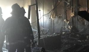 Fire fighters inspect the charred remains on the 22nd floor of the Air India building, Nariman Point, in South Mumbai on Tuesday.(HT) Fire fighters inspect the charred remains on the 22nd floor of the Air India building, Nariman Point, in South Mumbai on Tuesday.(HT)