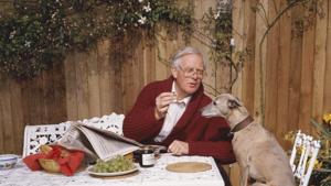 John L Carre offering his whippet a grape, circa 1990.(Terry O’Neill/Getty Images) John L Carre offering his whippet a grape, circa 1990.(Terry O’Neill/Getty Images)