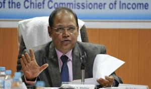 Chief income tax commissioner Vinod Kumar Mathur talks at a press meet in Indore on Friday.(Arun Mondhe/HT photo)