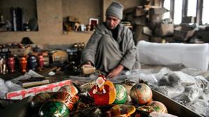 A Kashmiri artisan packs Christmas decorations to be exported.(Waseem Andrabi/HT Photo) A Kashmiri artisan packs Christmas decorations to be exported.(Waseem Andrabi/HT Photo)