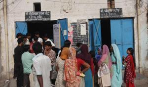 People wait outside a ration shop in Bawana.(HT File) People wait outside a ration shop in Bawana.(HT File)