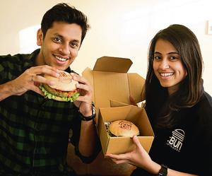 Sahib and Tanya, the couple who run Bun Intended, a goumet burger home delivery in Delhi. They cater to customers in the late night segment - 7pm to 4am.(Saumya Khandelwal / HT) Sahib and Tanya, the couple who run Bun Intended, a goumet burger home delivery in Delhi. They cater to customers in the late night segment - 7pm to 4am.(Saumya Khandelwal / HT)
