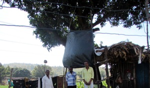 Family members of Pratap Lodhi, the farmer who was killed, at the disputed land at Raghogarh in Dewas district.