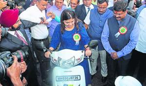 BJP’s youth wing president Poonam Mahajan rides a CNG bike. BJP’s youth wing president Poonam Mahajan rides a CNG bike.