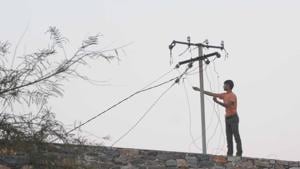 A man fiddles with a power line.(HT File Photo) A man fiddles with a power line.(HT File Photo)