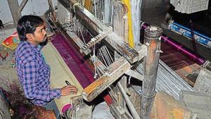A young weaver at work in Varanasi.(Rajesh Kumar/ HT Photo) A young weaver at work in Varanasi.(Rajesh Kumar/ HT Photo)