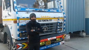 Gagandeep Singh stands in front of his truck.(HT Photo) Gagandeep Singh stands in front of his truck.(HT Photo)