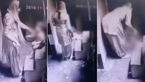 In December 2016, a security camera video showed a woman thrashing her one-year-old son. . In December 2016, a security camera video showed a woman thrashing her one-year-old son. .