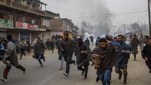 People run for cover from tear gas shells and pellets fired at them during a protest in Kakpora village, south of Srinagar.(AP File Photo) People run for cover from tear gas shells and pellets fired at them during a protest in Kakpora village, south of Srinagar.(AP File Photo)