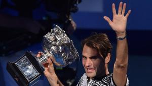 Roger Federer holds the winner's trophy during a victory lap following his win over Rafael Nadal in the Australian Open final.(AFP) Roger Federer holds the winner's trophy during a victory lap following his win over Rafael Nadal in the Australian Open final.(AFP)