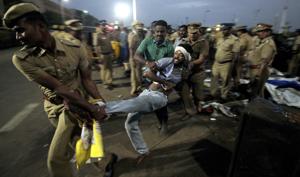 A protestor supporting Jallikattu tries to resist as police remove them from Chennai’s Marina beach on January 23.(AP File) A protestor supporting Jallikattu tries to resist as police remove them from Chennai’s Marina beach on January 23.(AP File)