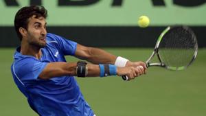 India's Yuki Bhambri returns a shot during the Davis Cup singles tennis match against New Zealand's Jose Statham.(AFP) India's Yuki Bhambri returns a shot during the Davis Cup singles tennis match against New Zealand's Jose Statham.(AFP)
