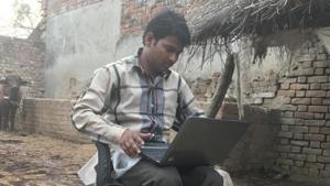 Mohammad Zakir sit with his laptop in his cowshed at Tarahia village on the outskirts of Lucknow. The free laptop scheme is one of chief minister Akhilesh Yadav’s flagship programmes.(Abhinav Rajput/HT Photo) Mohammad Zakir sit with his laptop in his cowshed at Tarahia village on the outskirts of Lucknow. The free laptop scheme is one of chief minister Akhilesh Yadav’s flagship programmes.(Abhinav Rajput/HT Photo)