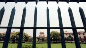 Supreme Court is pictured through a gate in New Delhi.(HT File Photo) Supreme Court is pictured through a gate in New Delhi.(HT File Photo)