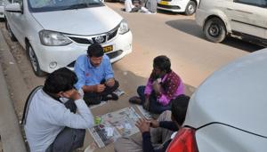 Cab drivers play cards during the sixth day of strike. The availability of cabs, however, was better on Tuesday.(Parveen Kumar/HT Photo) Cab drivers play cards during the sixth day of strike. The availability of cabs, however, was better on Tuesday.(Parveen Kumar/HT Photo)
