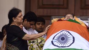 At J Jayalalithaa’s funeral, VK Sasikala (left) and her family surrounded the body of the former chief minister.(AFP) At J Jayalalithaa’s funeral, VK Sasikala (left) and her family surrounded the body of the former chief minister.(AFP)