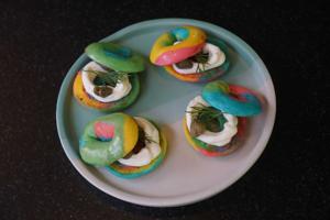 A plate of bite-sized, Instagram-friendly rainbow bagel amuse-bouches are presented immediately after we place our order. Chewy and firm with a filling of cream cheese and olives, they’re an amusing start to the meal.(Prodip Guha/HT Photo)