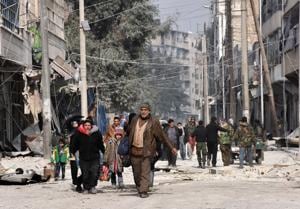 Syrian residents flee violence in Aleppo's eastern al-Salihin neighbourhood on December 12, 2016 after regime troops retook the area from rebel fighters.(AFP) Syrian residents flee violence in Aleppo's eastern al-Salihin neighbourhood on December 12, 2016 after regime troops retook the area from rebel fighters.(AFP)