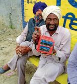 A farmer holding an auto-start switch used for tubewells(HT Photo) A farmer holding an auto-start switch used for tubewells(HT Photo)
